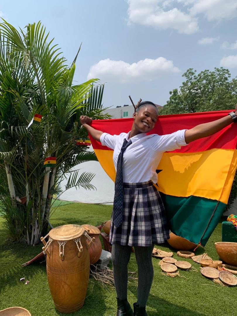 African Union Day — child holding Ghana flag