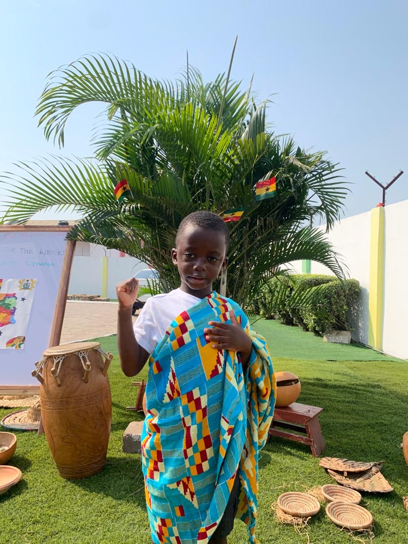 African Union Day — child in kente cloth