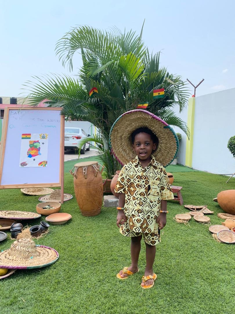 African Union Day — child in African print with straw hat