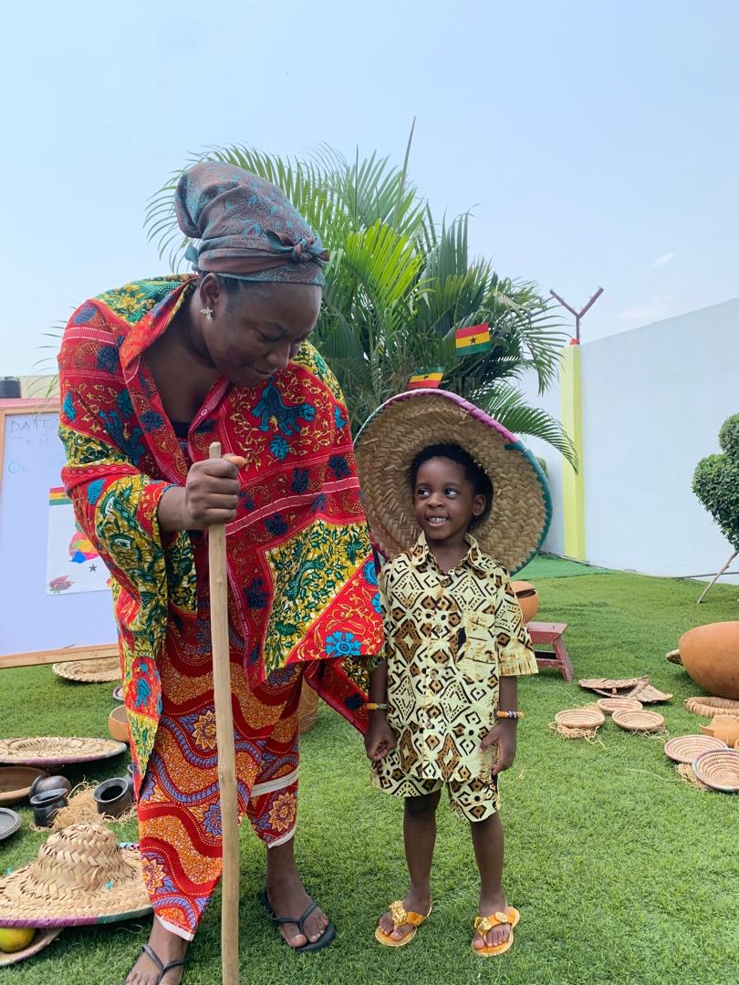 African Union Day — teacher and child in African dress