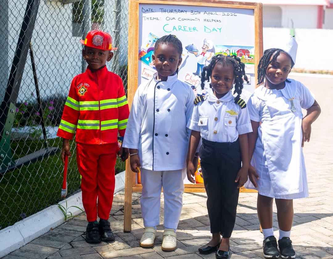 Career Day — children dressed as firefighter, chef, pilot and nurse