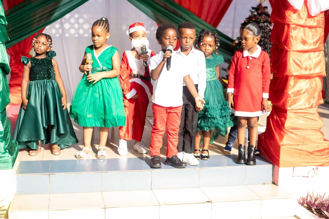 End of Year Show — children in Christmas outfits on stage