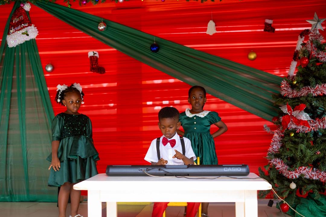 End of Year Show — child playing keyboard on stage