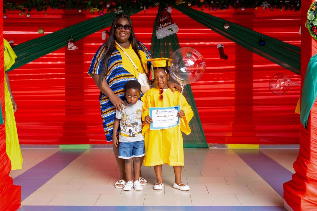 End of Year Show — parent and child at graduation